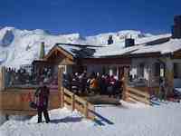 Pausing for a long lunch at one of the many huts that you'll find on the slopes at Austrian ski areas like in Austria's Oetzal Valley.