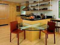 Home Decor - Clever Way to Maximize Space in a Small Kitchen. This table, attached to the end of a peninsula of cabinetry, is a clever way of maximizing space in a small kitchen