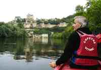 Canoeists get a dramatic view of the French village of Beynac as it tumbles down a steep hill from its majestic castle to the Dordogne River