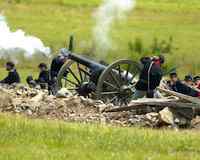 Union soldiers fire a cannon during a re-enactment of the Battle of Gettysburg