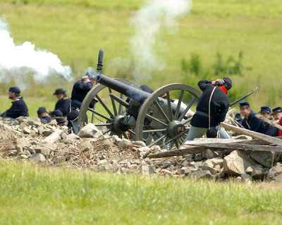 Union soldiers fire a cannon during a re-enactment of the Battle of Gettysburg
