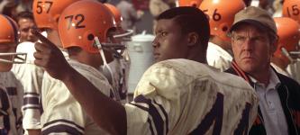 The Express (L to R, foreground) College football hero Ernie Davis (ROB BROWN) and Coach Ben Schwartzwalder (DENNIS QUAID) in a drama based on the true story of the running back who smashed barriers on and off the field The Express. Photo Credit: Universal Pictures Copyright: 2008 Universal Studios. ALL RIGHTS RESERVED.