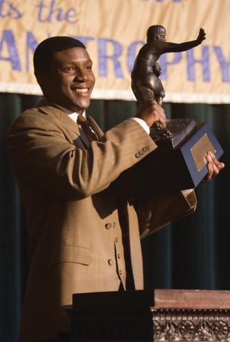 The Express College football hero Ernie Davis (ROB BROWN) proudly holds the Heisman Trophy in a drama based on the true story of the running back who smashed barriers on and off the field - The Express. Photo Credit: Chuck Hodes Copyright: 2008 Universal Studios. ALL RIGHTS RESERVED