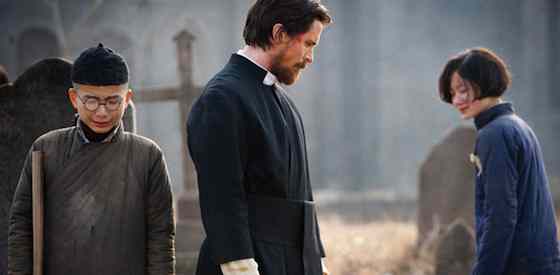 Christian Bale and Ni Niin The Flowers of War