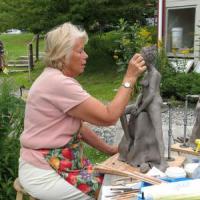 A student works on a sculpture at Snow Farm, the New England Craft Program