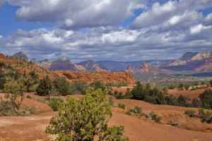 Morning clouds and blue skies over red rock country, uptown Sedona at rear