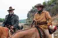 Jeff Bridges & Matt Damon  in the movie True Grit