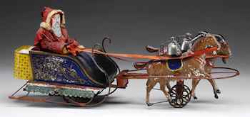 Christmas in July! Considered one of the rarest American-made tin toys, the Santa sleigh pulled by goats brought $161,000 recently in a James D. Julia auction. Photo courtesy of www.juliaauctions.com