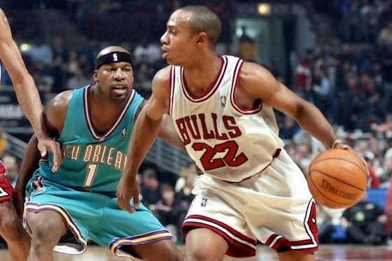 Chicago Bulls' guard Jay Williams (right) drives to the basket against New Orleans Hornets guard Baron Davis.