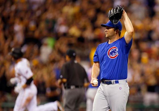 Chicago Cubs pitcher Adam Warren reacts after surrendering a home run in a game against the Pittsburgh Pirates.