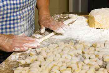 	Italian gnocchi are usually cylinders formed by rolling out the dough into a rope shape and cutting in into bite-sized pieces