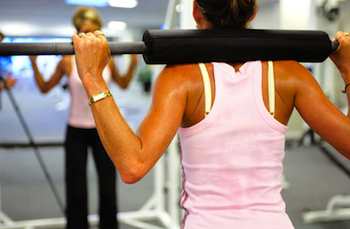 Balancing barbell across your shoulders while doing squats, lunges, or walking lunges helps develop posture and balance
