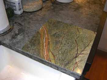 This single piece of granite tile will join others one day to make a complete countertop, but not without lots of work