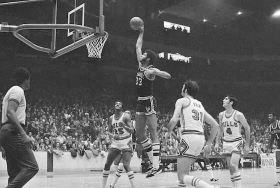 Kareem Abdul-Jabbar skies to dunk during a game against the Chicago Bulls in 1970.