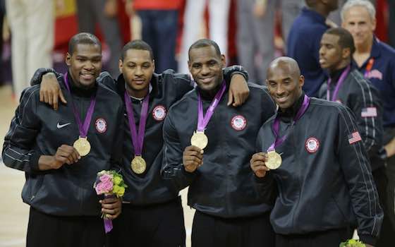 Kobe Bryant (right) displays his gold medal with teammates at the 2012 Summer Olympics.