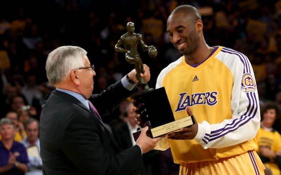 Los Angeles Lakers guard Kobe Bryant receives the MVP Trophy from former NBA commissioner David Stern.