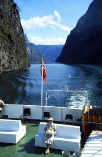 SOGNEFJORD Norway As the fjord narrows, the boat navigates past towering cliffs