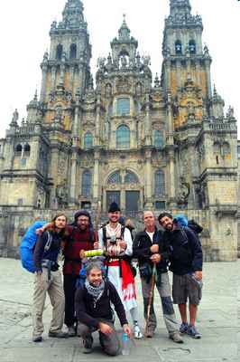 Pilgrims celebrate the end of their physical and spiritual journey in front of the cathedral in Spain's Santiago de Compostela.