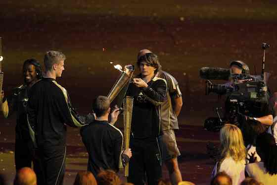 2012 Summer Olympics: Opening Ceremony - Young athletes carry the Olympic flame