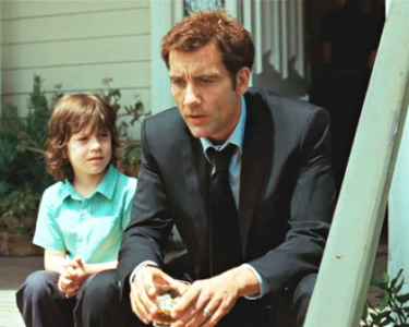 Clive Owen & Nicholas McAnulty in the movie The Boys Are Back