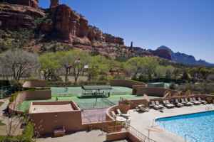 Enchantment's main pool and tennis courts, with the red-rock spire, Kachina Woman, at rear.