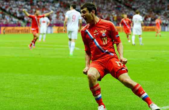 WARSAW, POLAND - JUNE 12: Alan Dzagoev of Russia celebrates scoring the first goal during the UEFA EURO 2012 group A match between Poland and Russia at The National Stadium on June 12, 2012 in Warsaw, Poland. (Photo by Shaun Botterill/Getty Images)