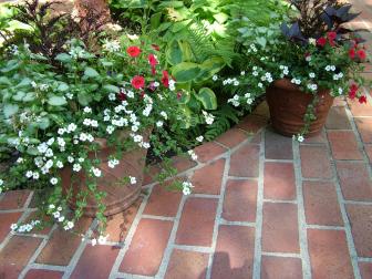 Ask the Builder by Tim Carter. This patio was built with pavers. They could have been set in sand, but laying them in mortar creates a traditional look and feel.