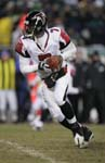 PHILADELPHIA - JANUARY 23: Quarterback Michael Vick #7 of the Atlanta Falcons carries the ball during the NFC Championship game against the Philadelphia Eagles at Lincoln Financial Field on January 23, 2005 in Philadelphia, Pennsylvania. Michael Vick. 2005 Getty Images